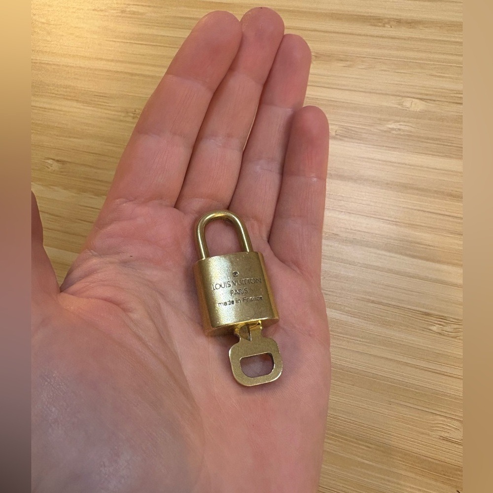 Louis Vuitton gold tone Padlock with‎ Key
